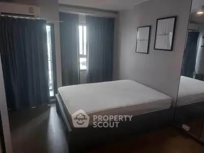 Modern bedroom with large windows and stylish decor