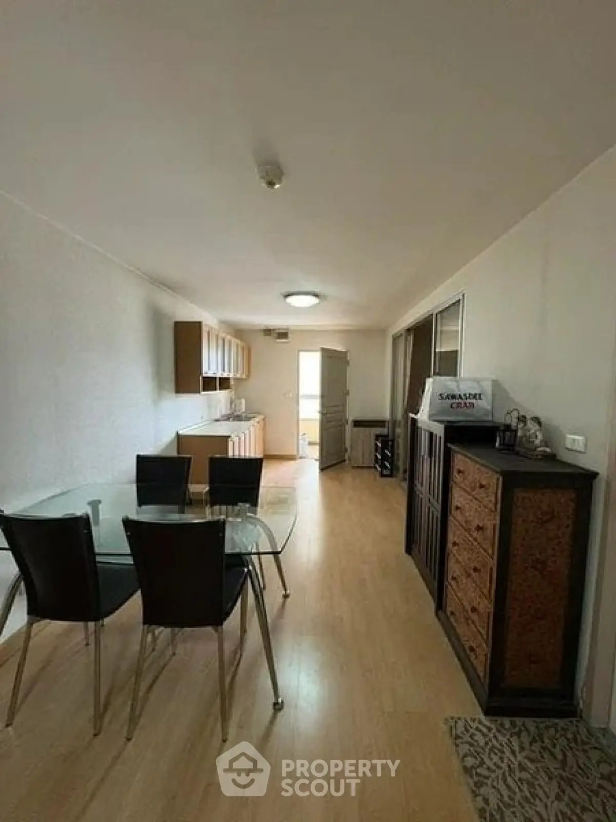 Spacious open-plan living and dining area with modern furnishings and ample natural light.