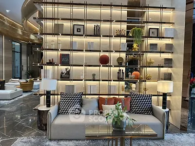 Luxurious modern living room with elegant decor and stylish shelving unit.