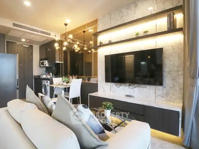 Luxurious modern living room with open kitchen, elegant lighting, and marble accents.