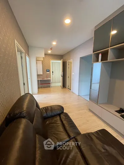 Modern living room with sleek leather sofa and stylish open layout