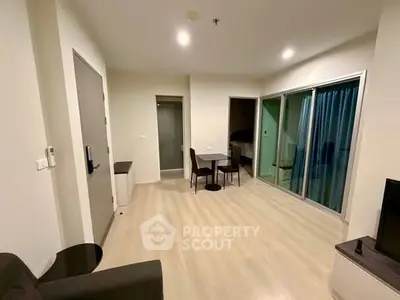 Modern living room with sleek furniture and sliding glass doors