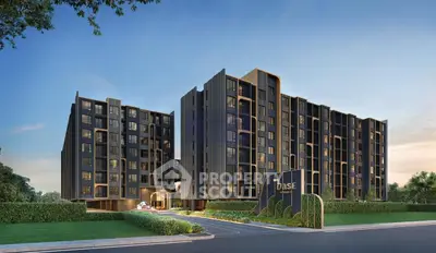 Modern residential building with sleek design and lush landscaping at sunset.