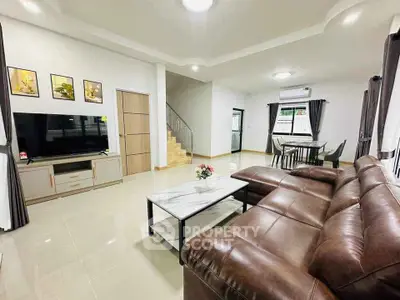 Spacious modern living room with leather sofa and elegant decor
