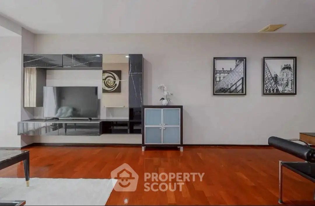 Spacious modern living room with sleek furniture and hardwood floors
