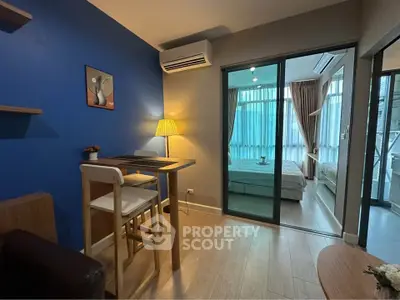 Modern apartment interior with cozy dining area and stylish bedroom view.