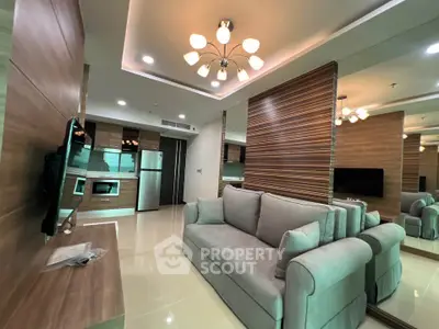Modern living room with stylish decor and open kitchen layout in a contemporary apartment.