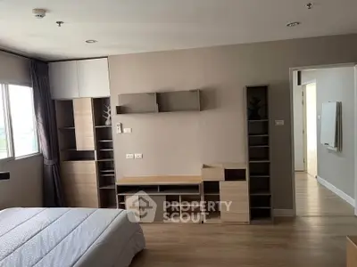 Modern bedroom with built-in storage and natural light