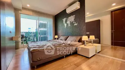 Luxurious bedroom with modern decor and balcony access in a stylish apartment