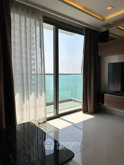 Luxurious living room with stunning ocean view from balcony