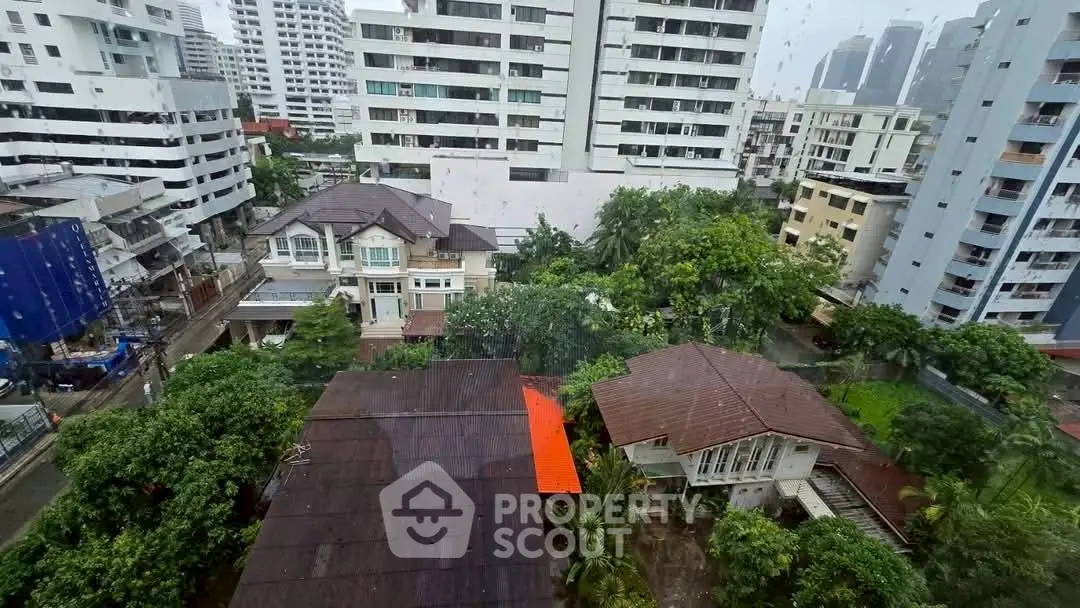 Stunning cityscape view with modern high-rise buildings and lush greenery, perfect for urban living.