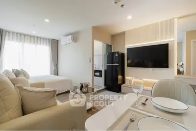 Modern open-plan living room with elegant decor and natural light