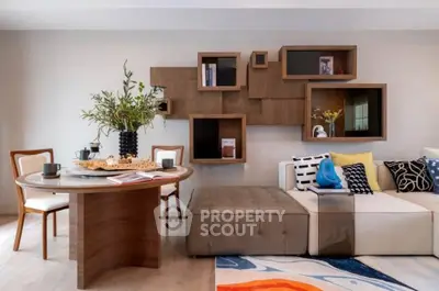 Modern living room with stylish furniture and decorative wall shelves