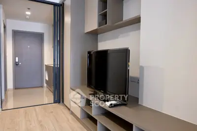 Modern living room with sleek TV unit and open layout in stylish apartment