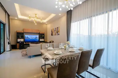 Luxurious modern living room with elegant dining area and large windows