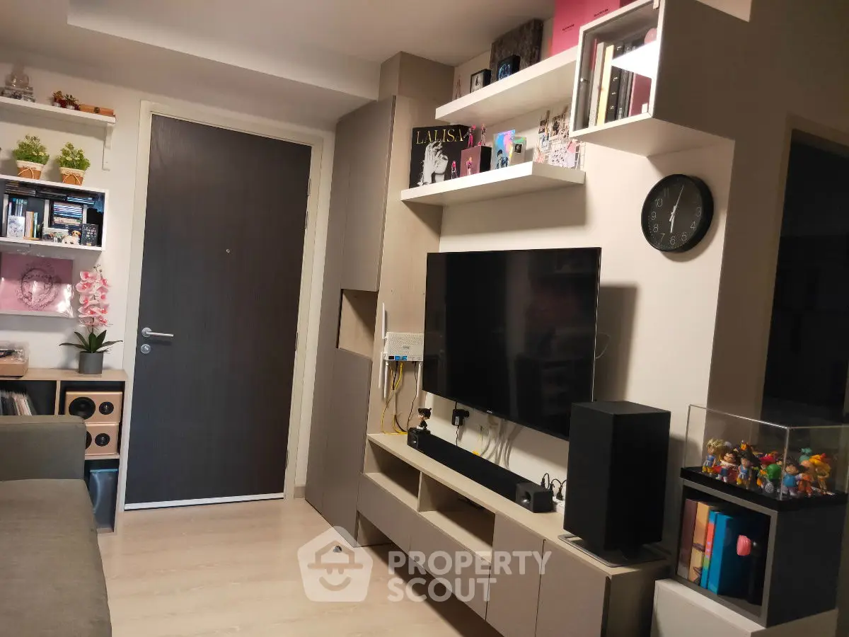 Modern living room with sleek TV setup and stylish shelving