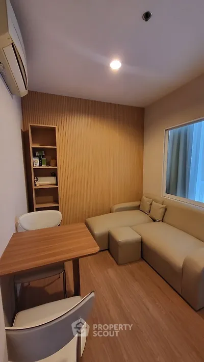 Cozy small living room with modern furniture and wooden accents