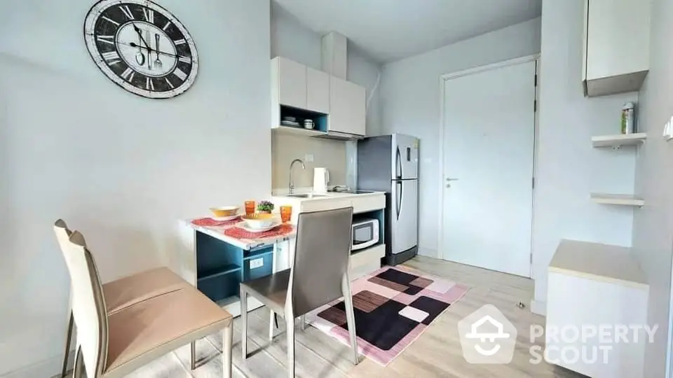 Modern compact kitchen with dining area and stylish decor