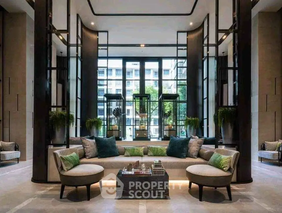 Luxurious modern living room with elegant decor and large windows offering a stunning city view.