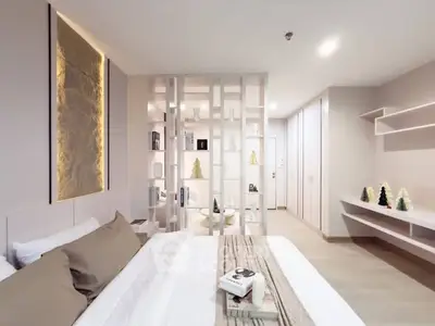 Modern bedroom with elegant decor and soft lighting, featuring a stylish partition and cozy bedding.