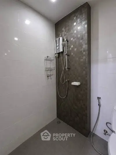 Modern bathroom with sleek shower design and tiled walls