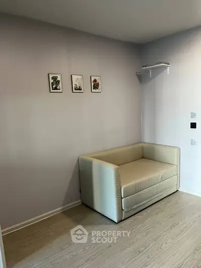Cozy minimalist living room with modern sofa and wall art