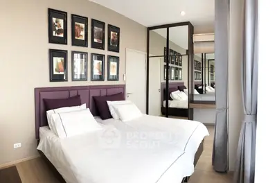 Modern bedroom with twin beds, stylish decor, and mirrored wardrobe in a cozy apartment.