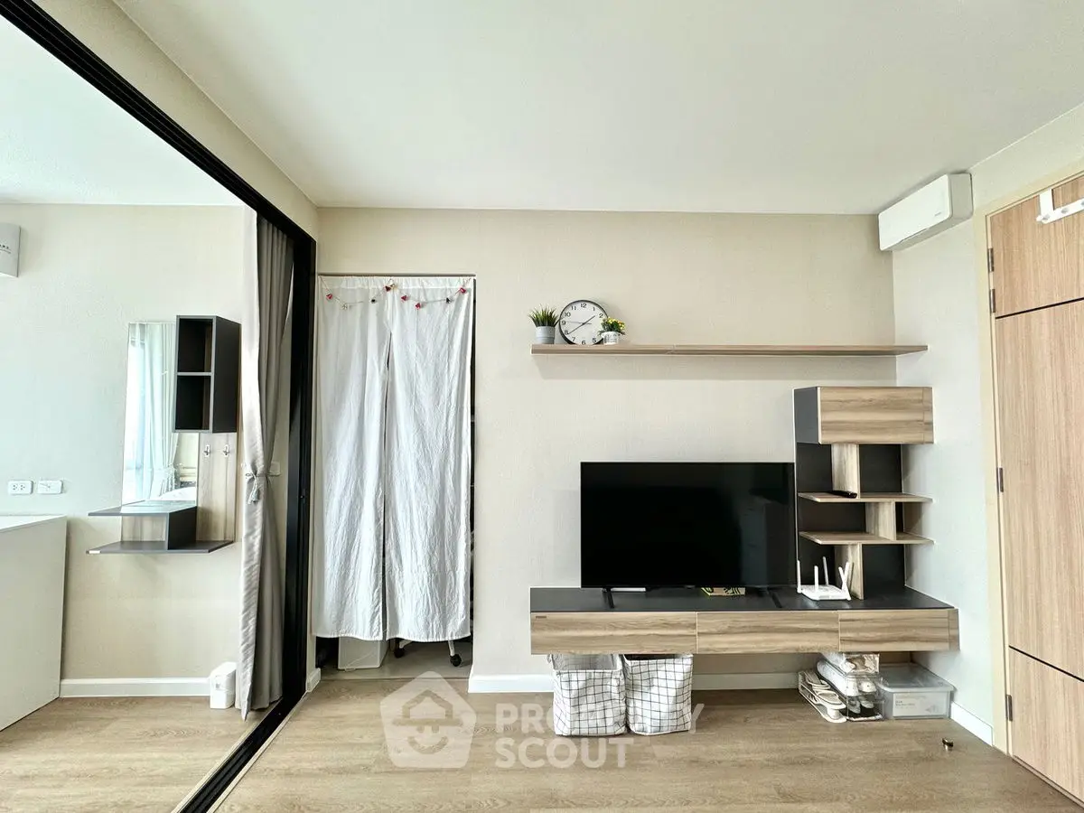 Modern living room with sleek TV unit and minimalist decor