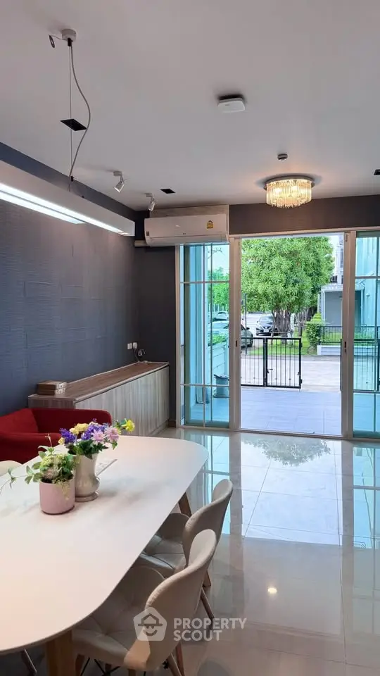 Modern living room with elegant dining area and garden view