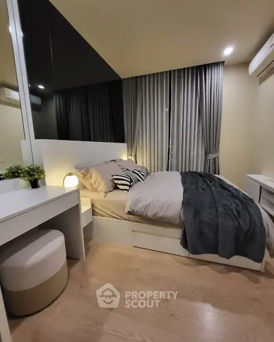 Cozy modern bedroom with stylish decor and soft lighting, perfect for relaxation and comfort.