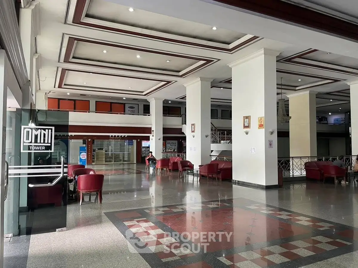 Spacious building lobby with elegant design and comfortable seating area.
