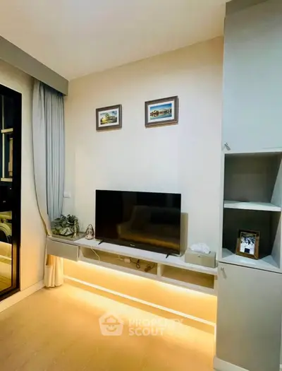 Modern living room with sleek TV setup and ambient lighting
