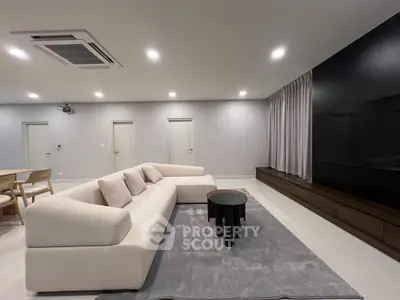 Spacious modern living room with elegant sofa and sleek decor