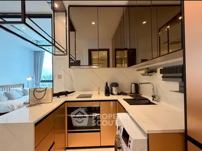Modern kitchen with sleek cabinetry and integrated appliances in a stylish apartment