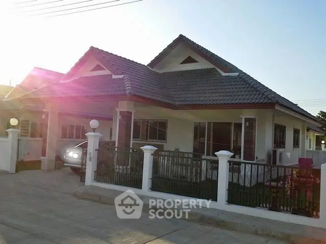 Charming suburban home with a spacious driveway and modern design.