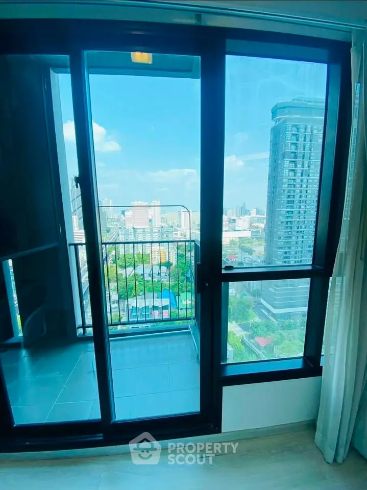 Stunning high-rise apartment with floor-to-ceiling windows and breathtaking city views.