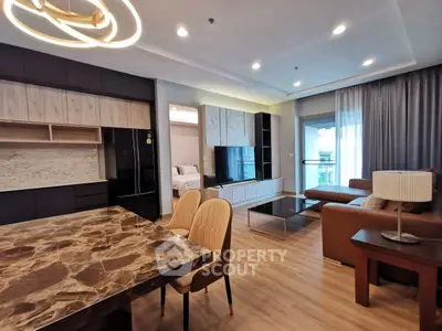Modern open-plan living room with elegant dining area and stylish decor