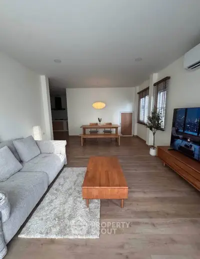 Spacious modern living room with stylish furniture and natural light