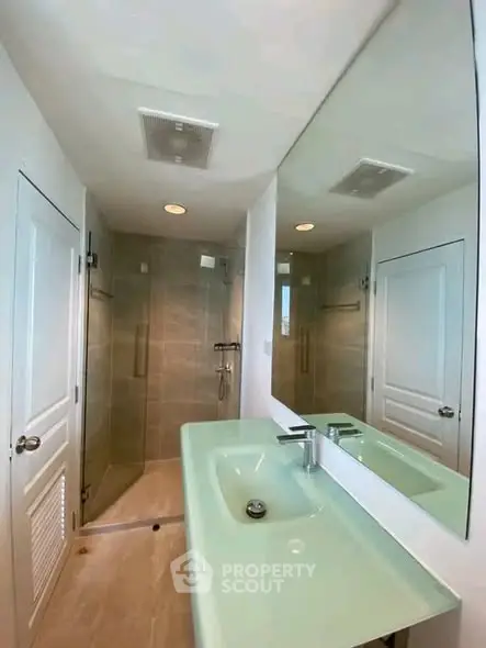 Modern bathroom with sleek design and spacious shower area