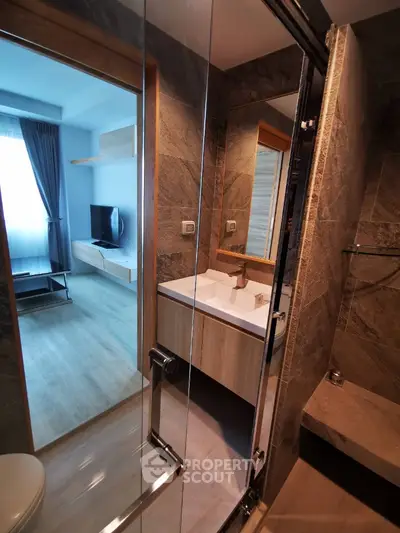 Modern bathroom with sleek design and glass shower enclosure