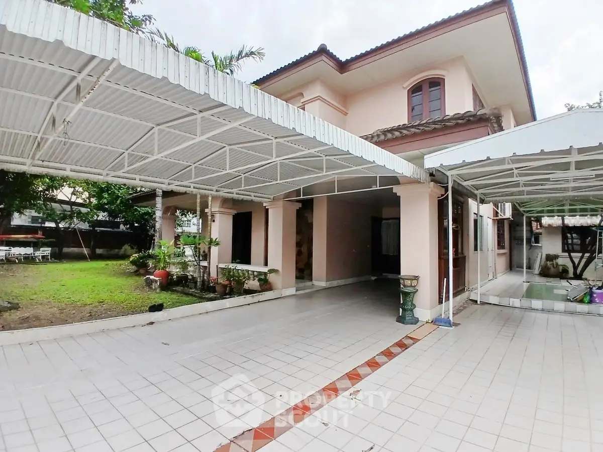 Spacious two-story home with covered parking and lush garden