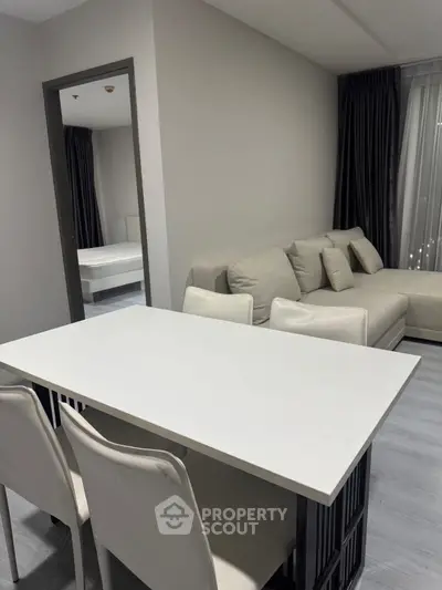 Modern living room with sleek furniture and neutral tones, perfect for stylish urban living.