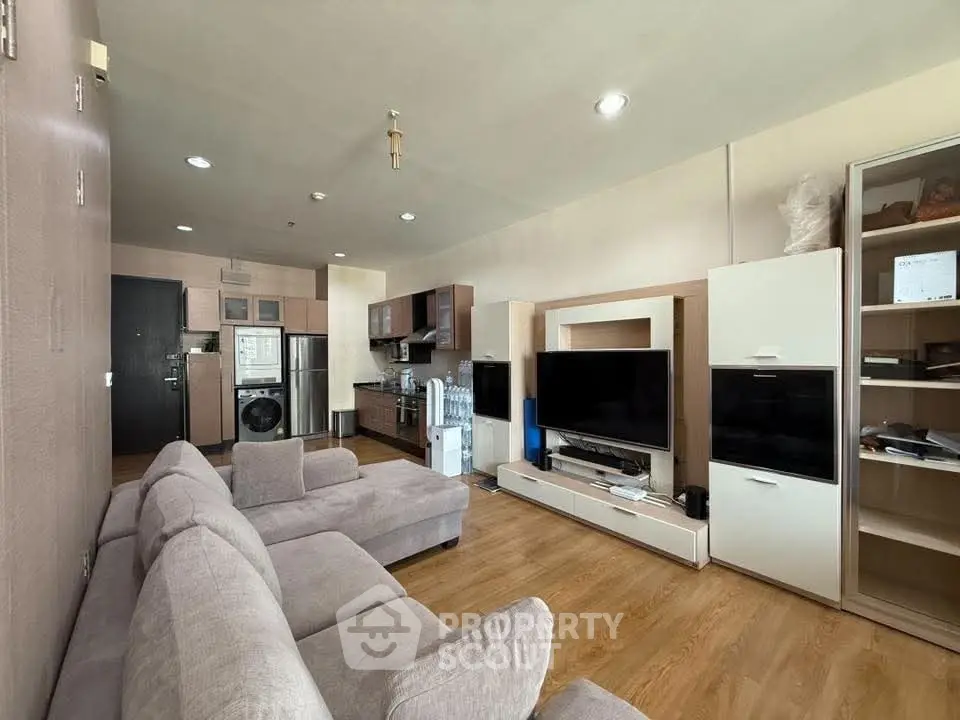 Spacious modern living room with open kitchen and stylish furniture