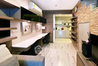 Modern living room with stylish decor and open kitchen layout in a cozy apartment.