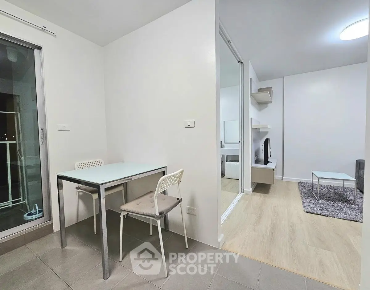 Modern apartment interior with dining area and cozy living room