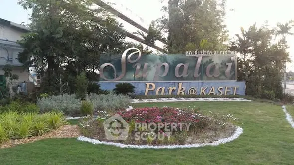 Supalai Park Kaset entrance with lush landscaping and signage