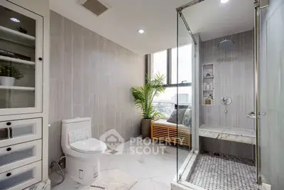 Luxurious modern bathroom with glass shower and city view, featuring elegant tile design and natural light.