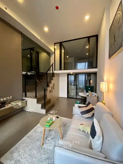 Modern duplex living room with high ceilings and stylish decor