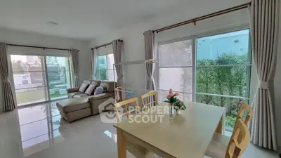 Spacious living room with garden view and elegant decor