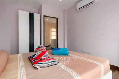 Cozy bedroom with modern air conditioning and stylish decor